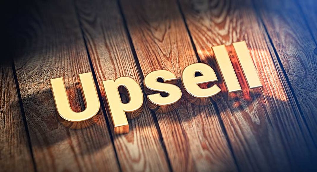 The word "Upsell" is lined with gold letters on wooden planks. 3D illustration jpeg